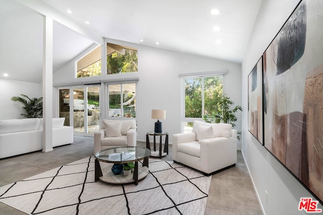 living room featuring beamed ceiling, high vaulted ceiling, and a healthy amount of sunlight