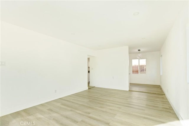 unfurnished room with light hardwood / wood-style floors