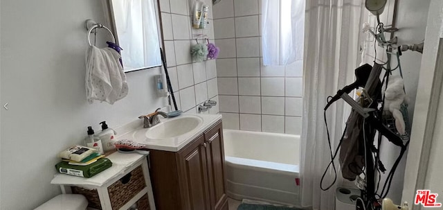 bathroom with vanity and shower / bath combo with shower curtain