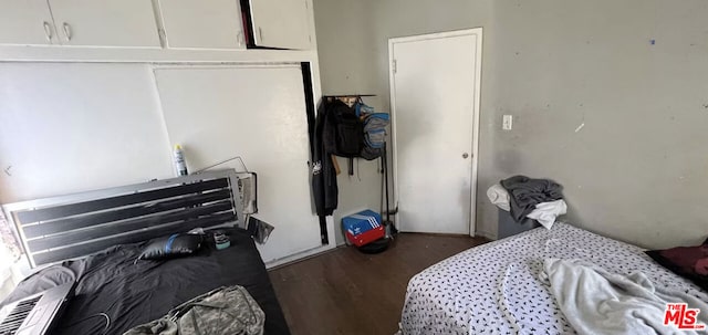 bedroom featuring dark hardwood / wood-style floors