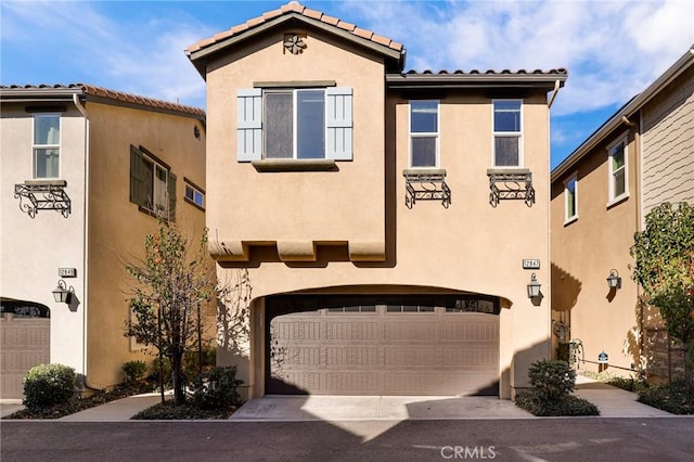 mediterranean / spanish-style house featuring a garage