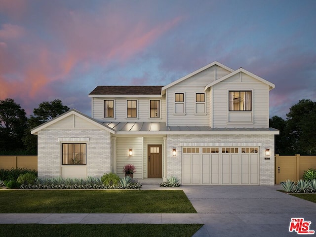 view of front of house with a garage and a lawn