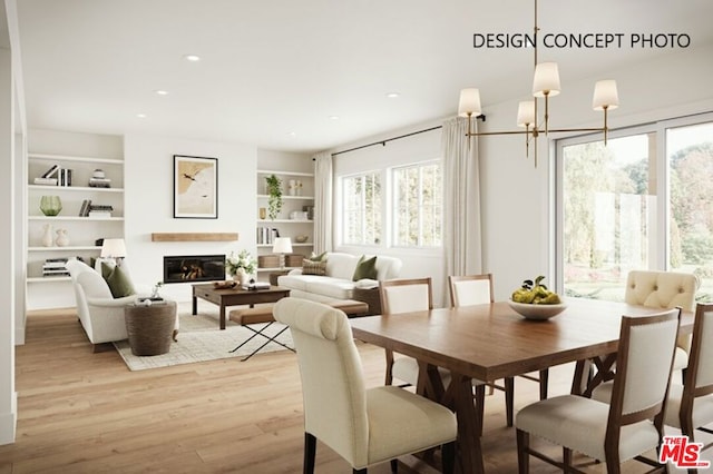 dining room featuring light wood-type flooring, a chandelier, and built in features