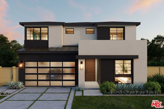 modern home featuring a balcony and a garage