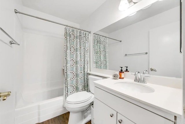 full bathroom with toilet, wood-type flooring, vanity, and shower / bath combination with curtain