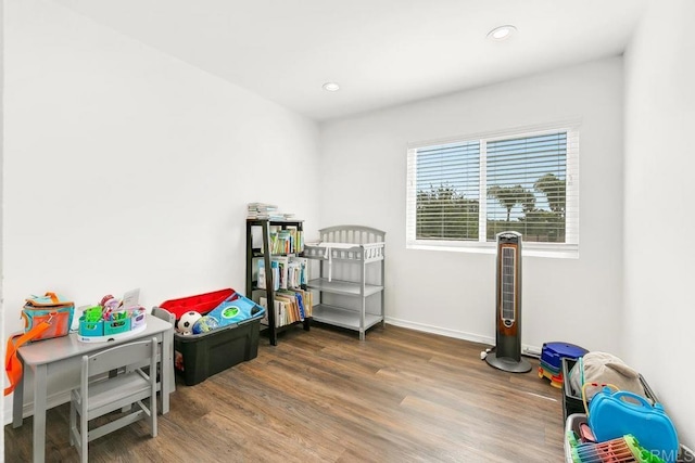 bedroom featuring dark hardwood / wood-style flooring