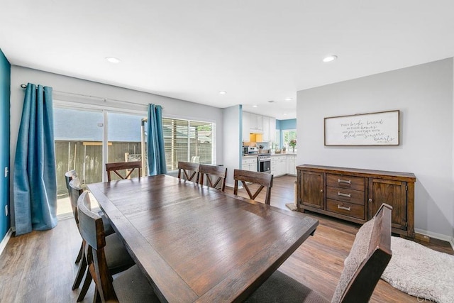 dining area with light hardwood / wood-style flooring