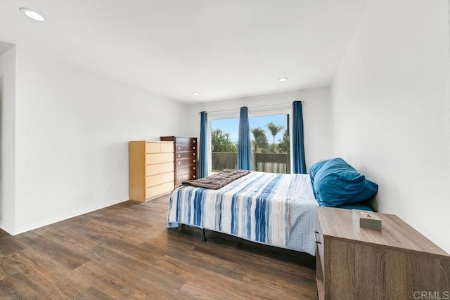 bedroom featuring dark wood-type flooring