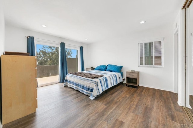 bedroom featuring access to outside and dark hardwood / wood-style floors