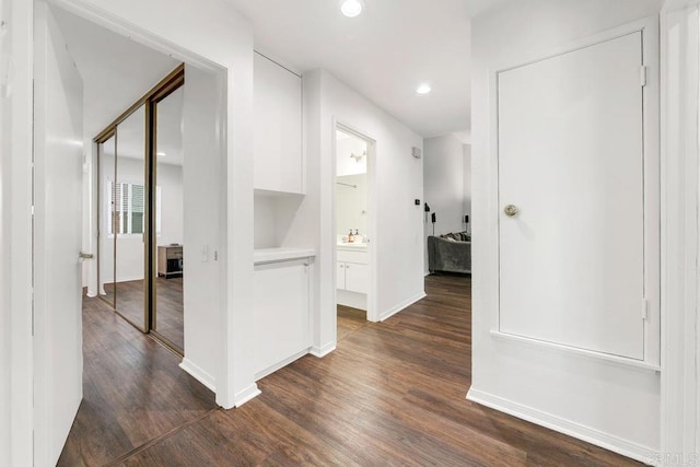 hallway featuring dark hardwood / wood-style flooring