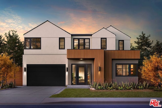 view of front of home featuring a balcony and a garage