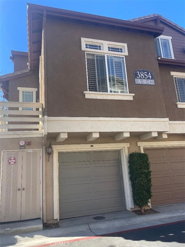 view of side of home featuring a garage