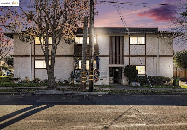 view of outdoor building at dusk