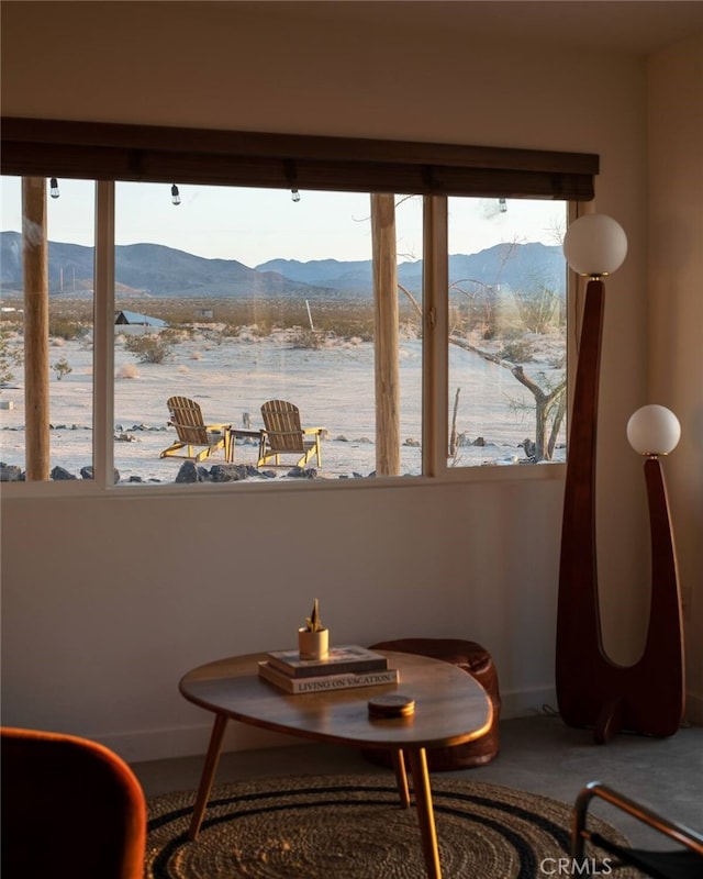 interior space with a healthy amount of sunlight and a water and mountain view