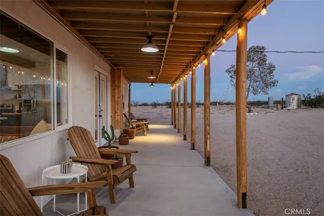 view of patio terrace at dusk