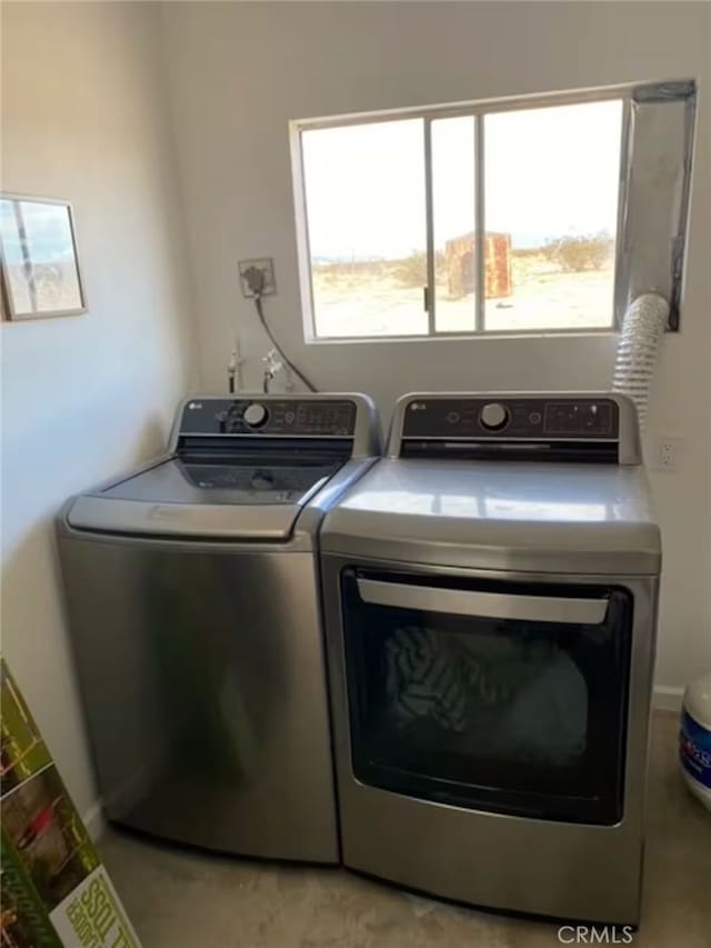 washroom featuring washing machine and dryer