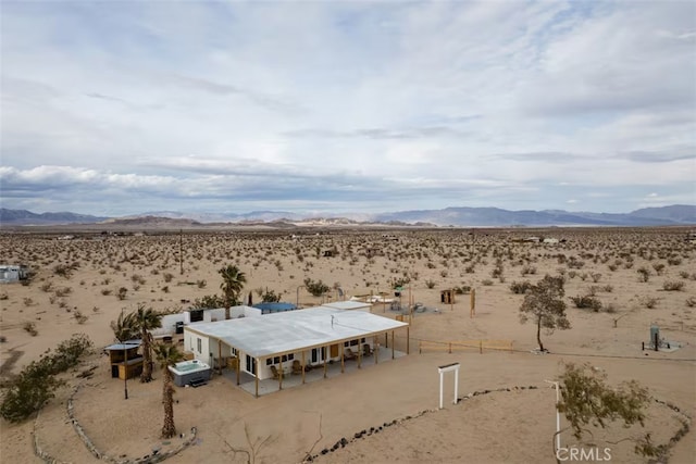 drone / aerial view featuring a mountain view