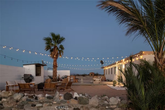 patio terrace at dusk with area for grilling