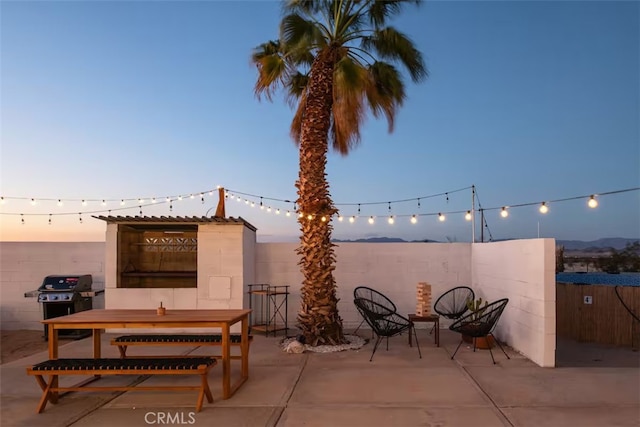 patio terrace at dusk with grilling area