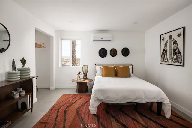 bedroom with an AC wall unit