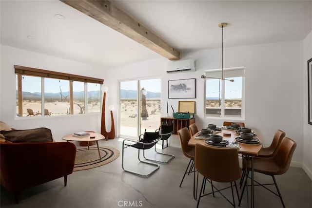 sunroom featuring a mountain view, a wall unit AC, a healthy amount of sunlight, and beamed ceiling