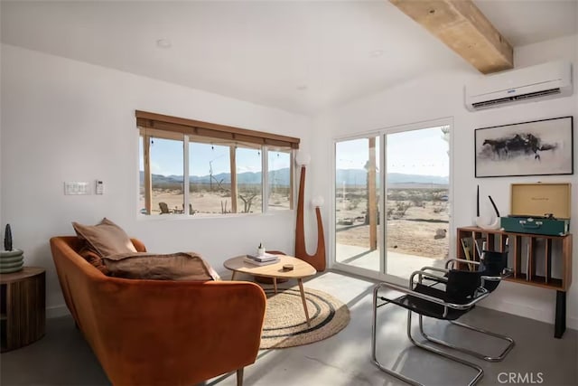 living area featuring a wall mounted AC, a mountain view, and beam ceiling