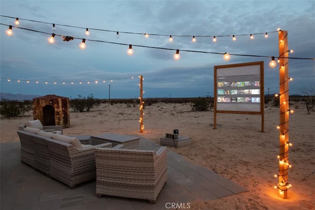 view of patio terrace at dusk