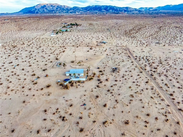 birds eye view of property featuring a mountain view