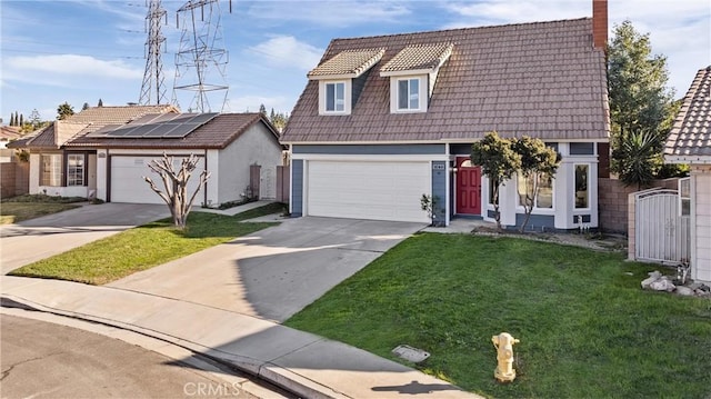 view of front of house with solar panels and a front lawn