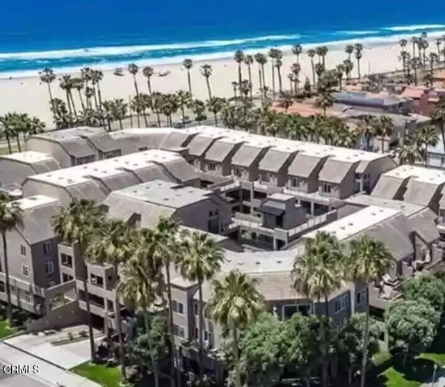 bird's eye view featuring a view of the beach and a water view