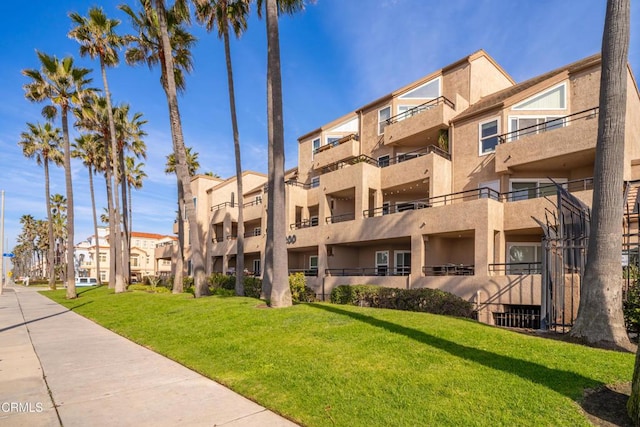 1200 Pacific Coast Hwy Unit 108, Huntington Beach, CA 92648 - view of building exterior with a residential view