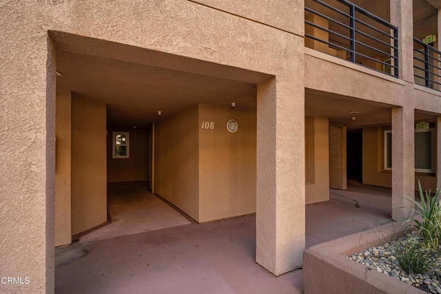 1200 Pacific Coast Hwy Unit 108, Huntington Beach, CA 92648 - exterior space featuring stucco siding and a patio
