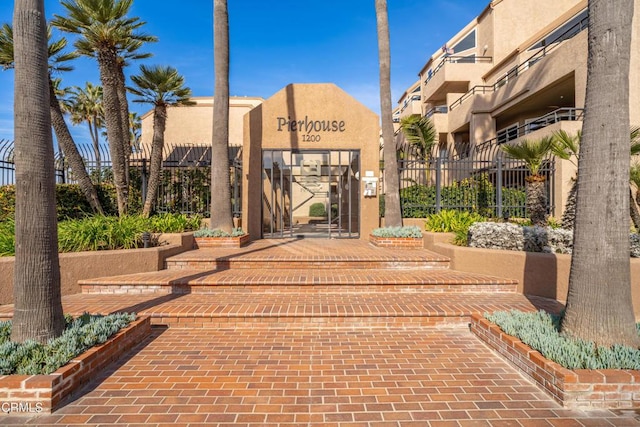 1200 Pacific Coast Hwy Unit 108, Huntington Beach, CA 92648 - view of building exterior with fence