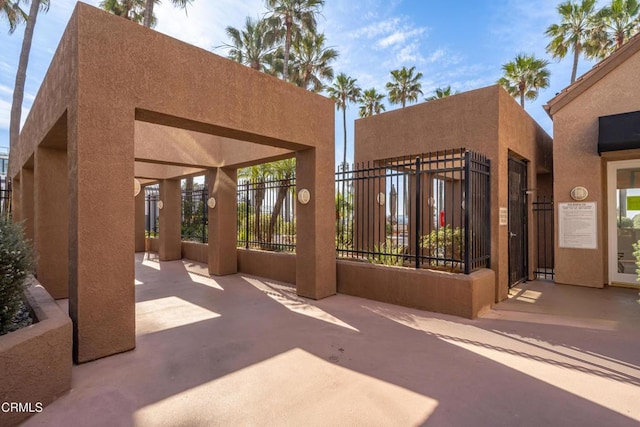 1200 Pacific Coast Hwy Unit 108, Huntington Beach, CA 92648 - view of patio featuring fence