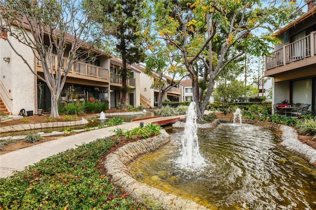 view of home's community with a water view