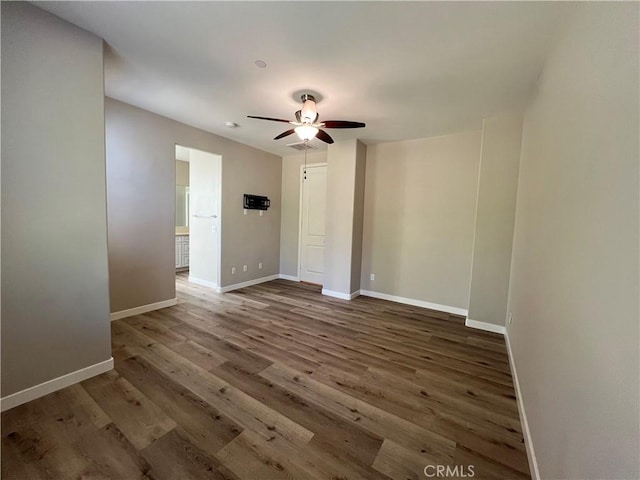 unfurnished room featuring ceiling fan and wood-type flooring