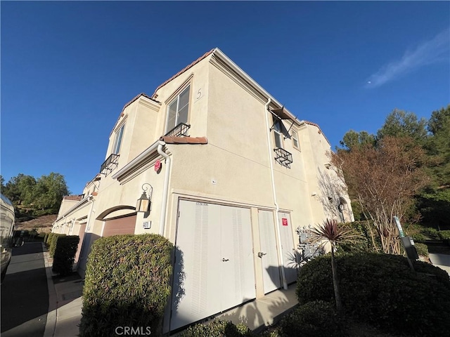 view of property exterior featuring a garage