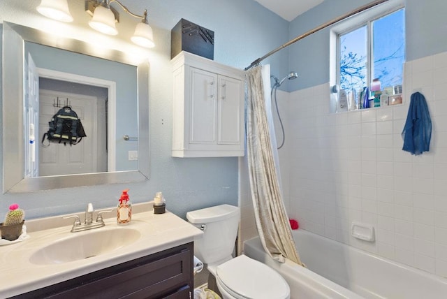 full bathroom with toilet, vanity, and shower / bath combo with shower curtain