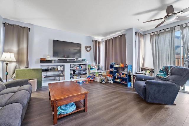 living room with ceiling fan and hardwood / wood-style flooring