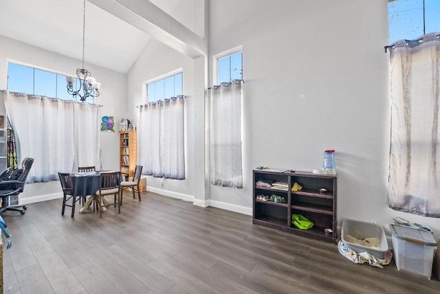 interior space with an inviting chandelier, lofted ceiling, and wood-type flooring