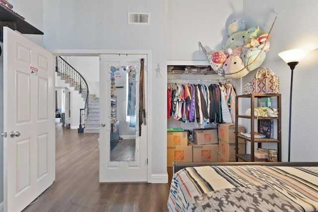 bedroom with a closet and dark hardwood / wood-style flooring