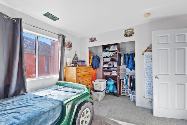 bedroom with carpet floors and a closet