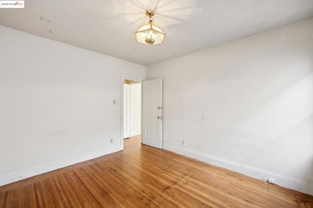 spare room featuring hardwood / wood-style flooring