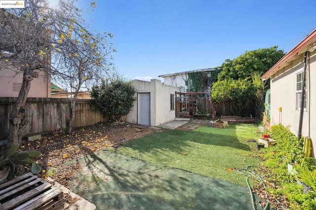 view of yard with an outbuilding and a patio area