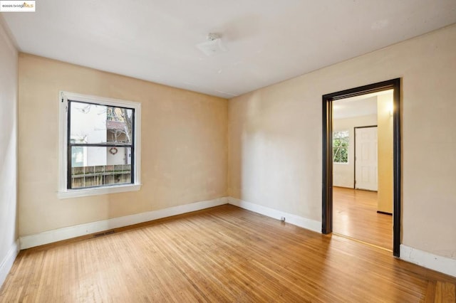 spare room featuring light hardwood / wood-style flooring