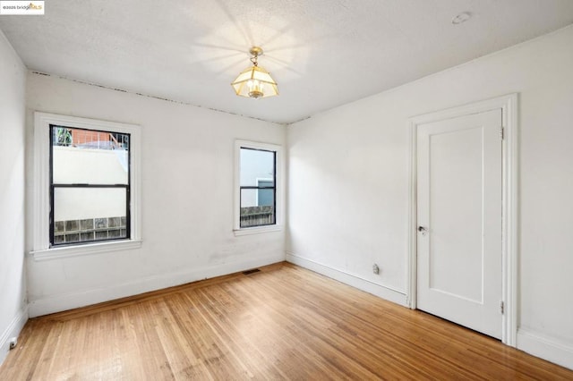 empty room featuring hardwood / wood-style floors