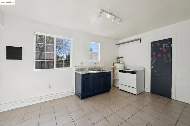 kitchen featuring sink, white electric stove, light tile patterned flooring, and electric panel