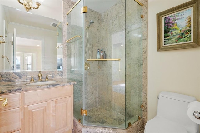 bathroom featuring toilet, an enclosed shower, crown molding, and vanity