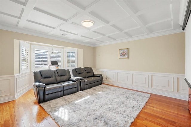 living room featuring beam ceiling, light hardwood / wood-style floors, and coffered ceiling