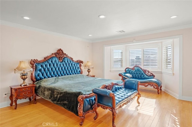 bedroom with crown molding and wood-type flooring